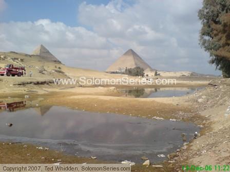 Pyramid region view from south (southeast) of the Sphinx and great pyramid.  This was a 2006 view just before Christmas showing standing water that is